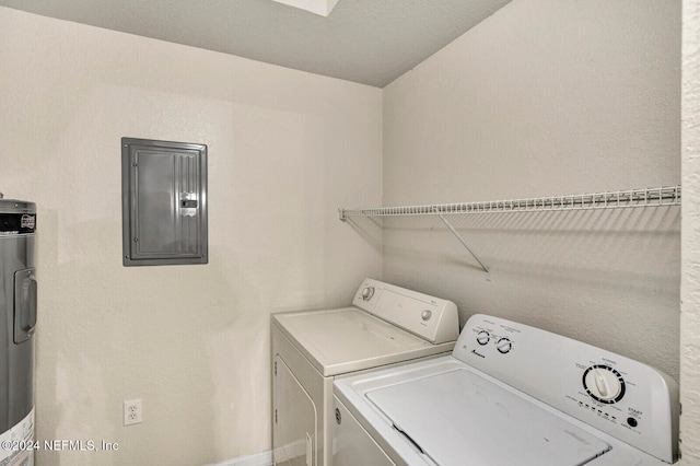 laundry area with electric panel, separate washer and dryer, and electric water heater