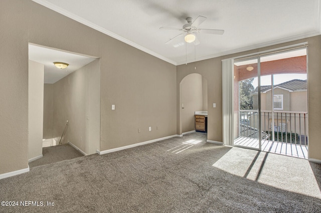 spare room featuring carpet flooring, ceiling fan, and ornamental molding