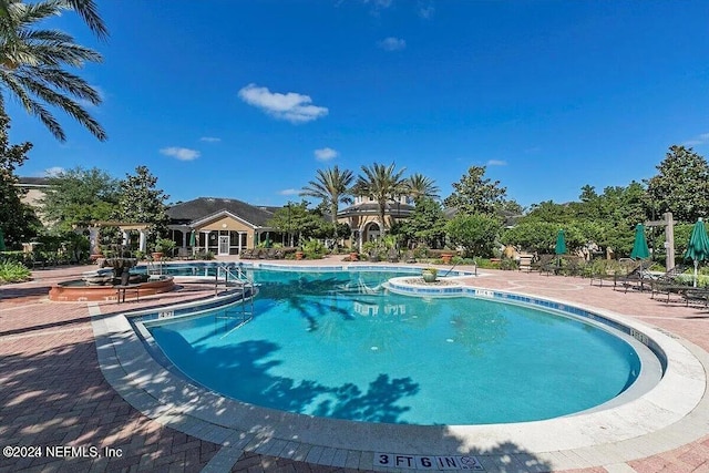 view of pool featuring a patio area