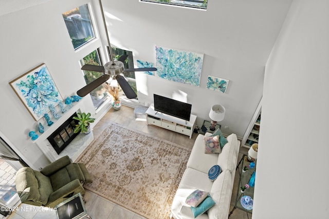 tiled living room with high vaulted ceiling