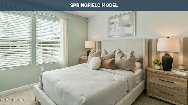 bedroom featuring light colored carpet