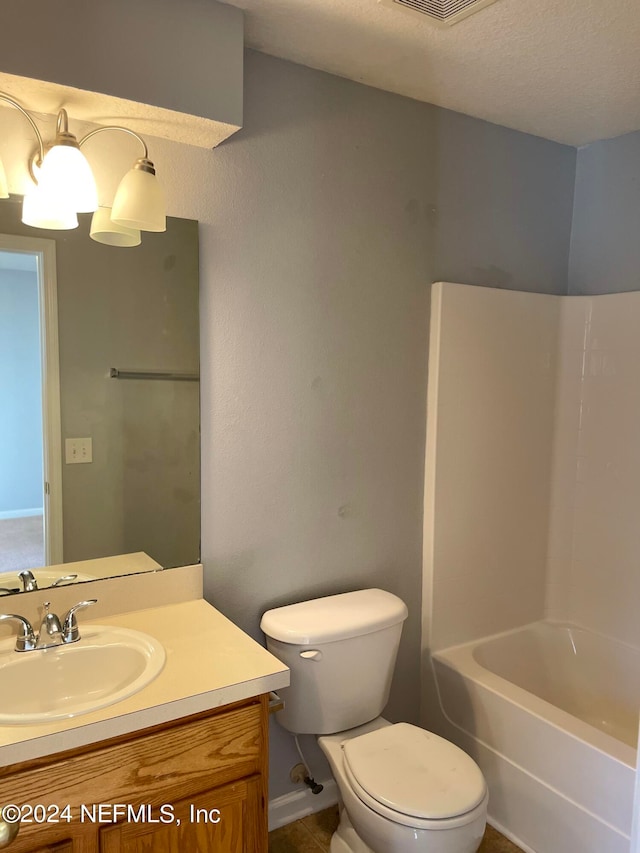 full bathroom featuring vanity, toilet, a textured ceiling, and bathtub / shower combination