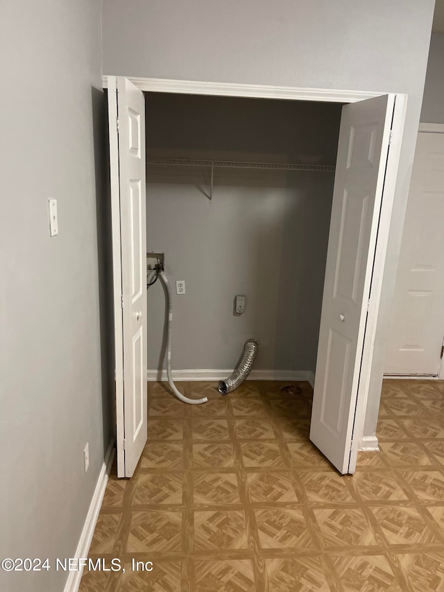 laundry area featuring hookup for a washing machine and light parquet flooring