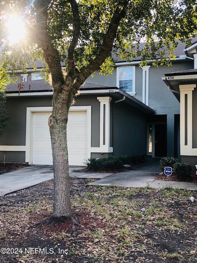 view of side of home featuring a garage