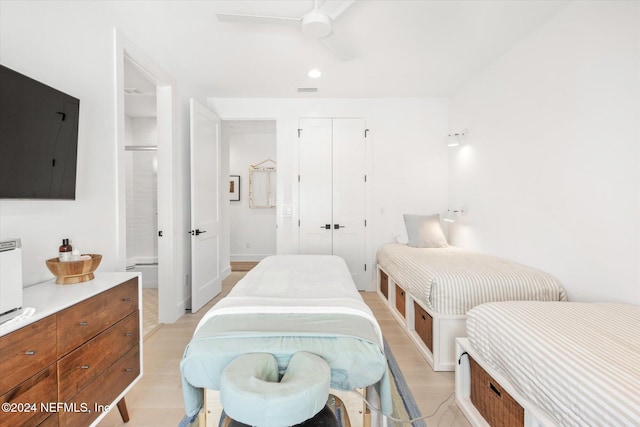 bedroom featuring light hardwood / wood-style floors and ceiling fan