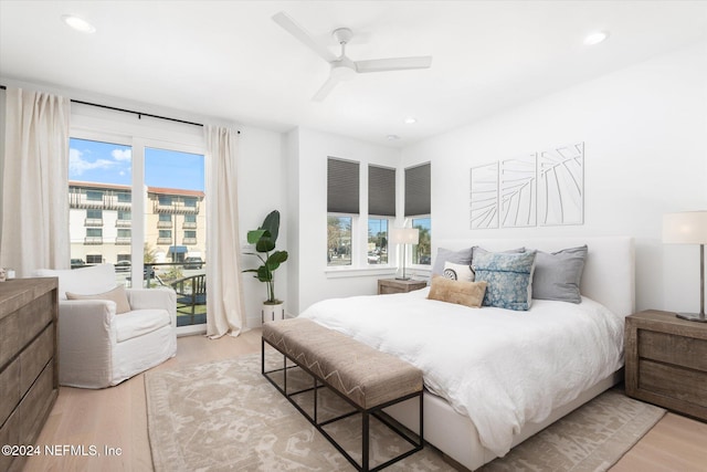 bedroom with ceiling fan and light hardwood / wood-style flooring