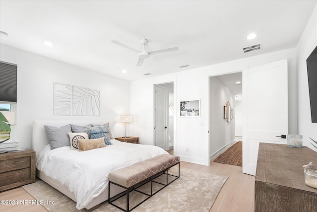 bedroom with ceiling fan and light hardwood / wood-style floors