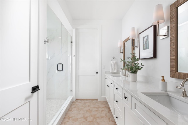 bathroom featuring vanity and an enclosed shower