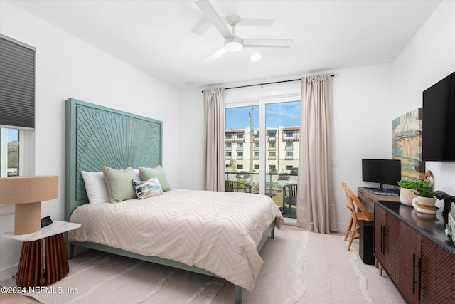 bedroom featuring access to exterior, light carpet, multiple windows, and ceiling fan