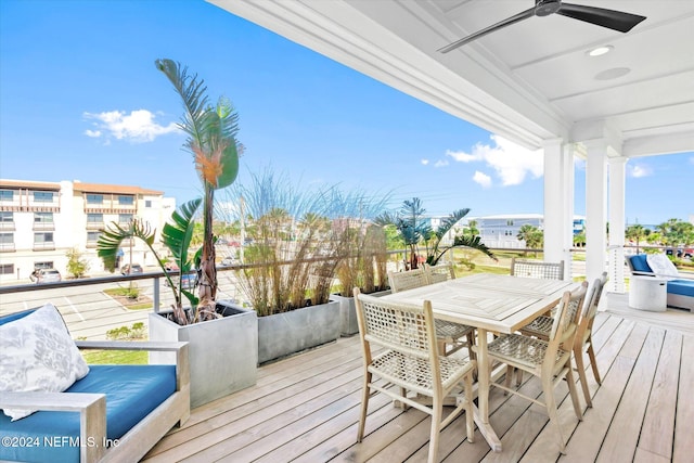 wooden terrace featuring ceiling fan