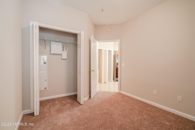 corridor with light colored carpet