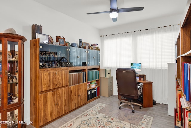 home office with ceiling fan and light hardwood / wood-style floors