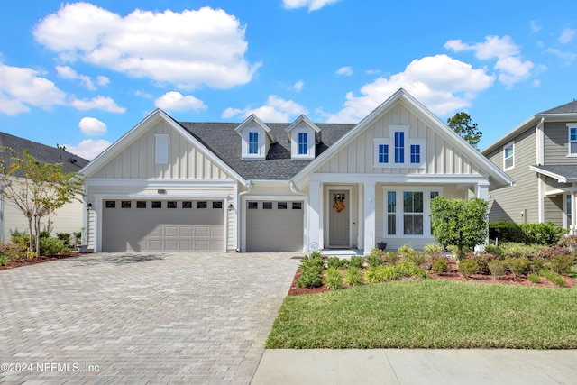 view of front of house with a garage and a front yard