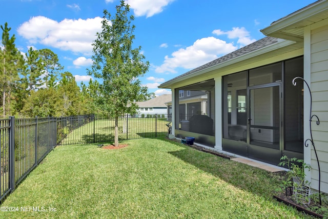 view of yard featuring a sunroom