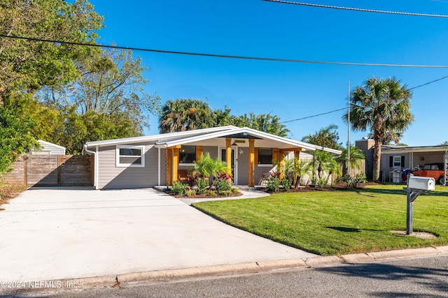 view of front of property with a porch and a front yard