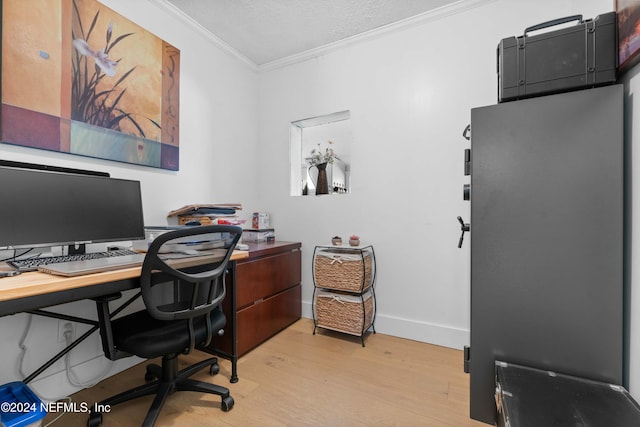 home office featuring a textured ceiling, light hardwood / wood-style flooring, and ornamental molding