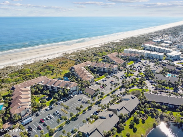 birds eye view of property featuring a view of the beach and a water view