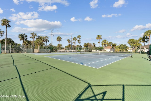 view of tennis court featuring basketball court