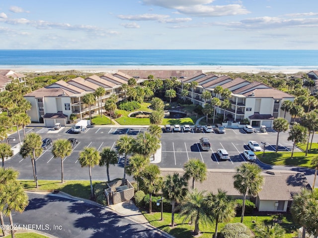 aerial view featuring a water view and a beach view