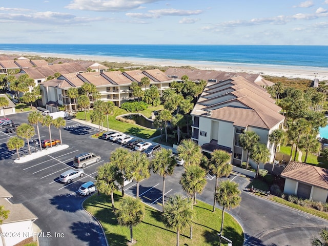 birds eye view of property featuring a water view and a view of the beach