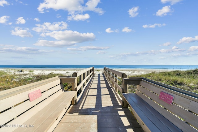 surrounding community featuring a view of the beach and a water view