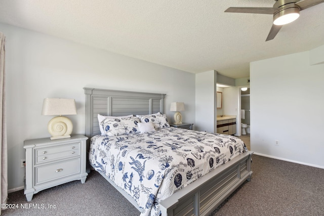 carpeted bedroom featuring a textured ceiling, connected bathroom, and ceiling fan