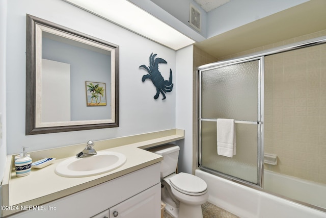 full bathroom featuring vanity, toilet, and enclosed tub / shower combo