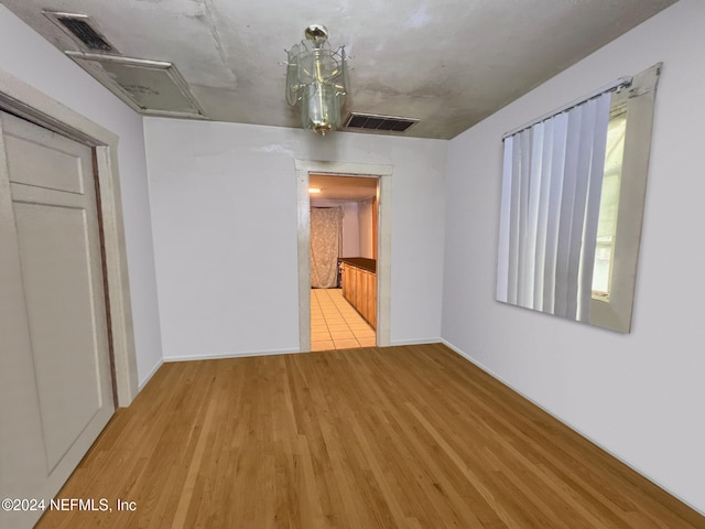 empty room with light wood-type flooring