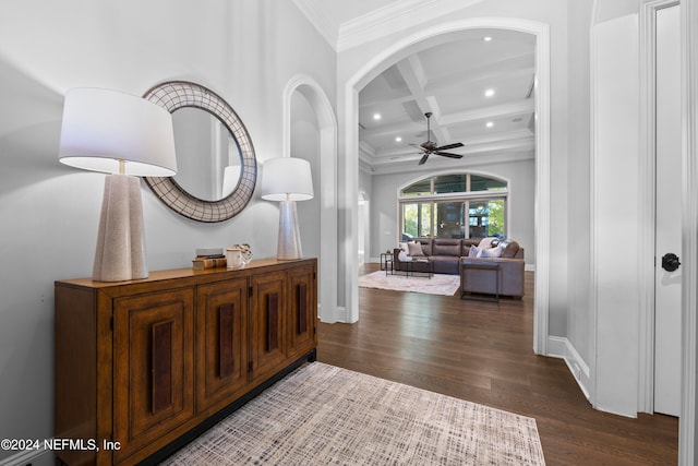 entryway with ornamental molding, coffered ceiling, ceiling fan, beamed ceiling, and dark hardwood / wood-style floors