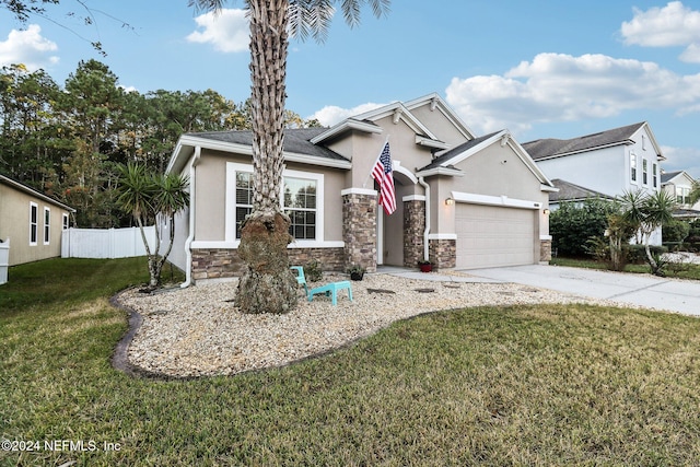 view of front of house with a garage and a front yard