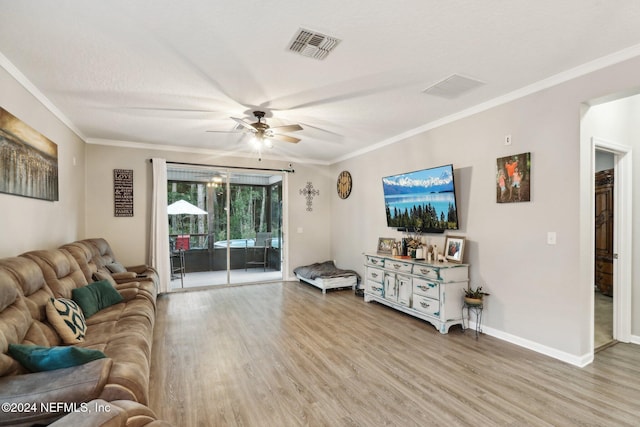 living room with ceiling fan, ornamental molding, a textured ceiling, and light hardwood / wood-style flooring