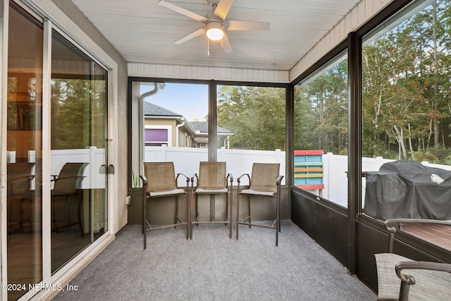 sunroom / solarium with ceiling fan