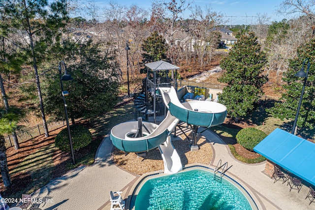 view of swimming pool featuring a gazebo, a playground, and a water slide