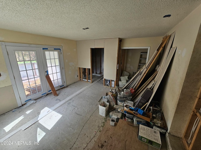 interior space with a textured ceiling