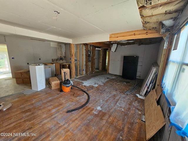 basement featuring dark wood-type flooring