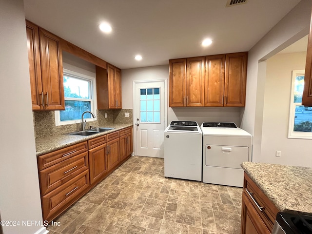 laundry area featuring sink and washing machine and clothes dryer