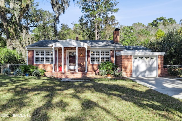 single story home with a garage and a front lawn