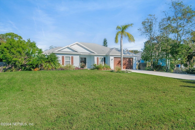 single story home featuring a front yard and a garage