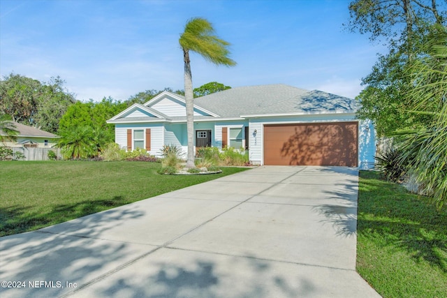 single story home with a front yard and a garage