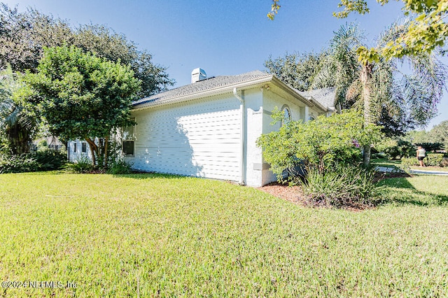 view of home's exterior featuring a yard