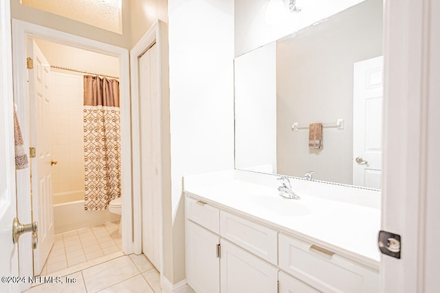 full bathroom featuring shower / bathtub combination with curtain, tile patterned flooring, a textured ceiling, toilet, and vanity