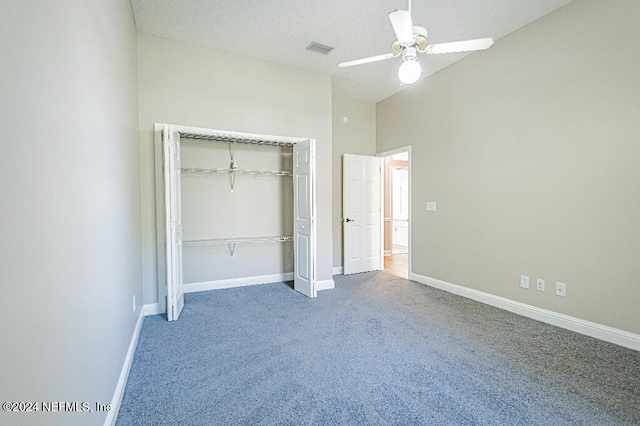 unfurnished bedroom featuring carpet, a closet, and ceiling fan