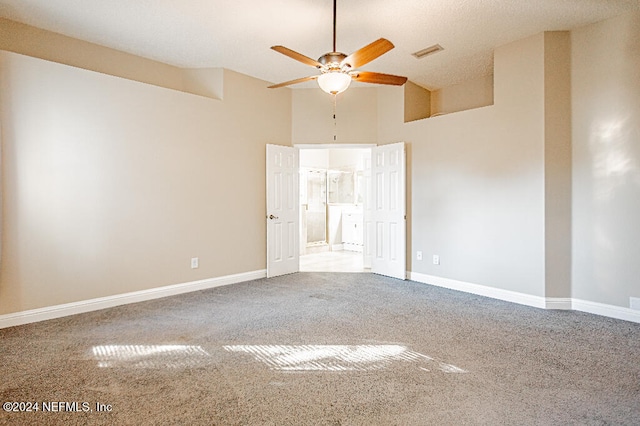 unfurnished room with carpet, a textured ceiling, and ceiling fan