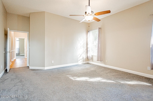 unfurnished room featuring carpet flooring and ceiling fan