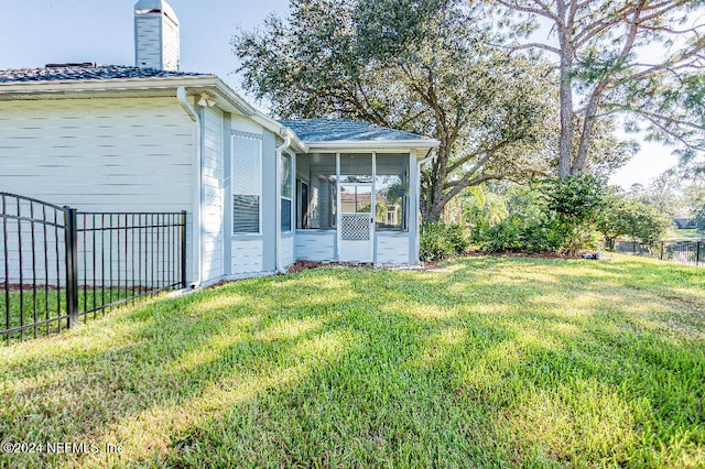 view of yard featuring a sunroom