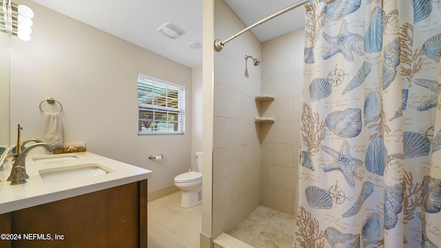 bathroom with toilet, tile patterned flooring, vanity, and a shower with shower curtain