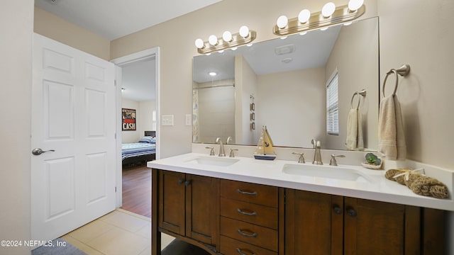 bathroom featuring a shower, wood-type flooring, and vanity