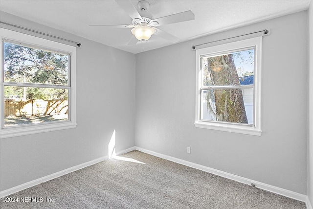 unfurnished room with carpet and ceiling fan