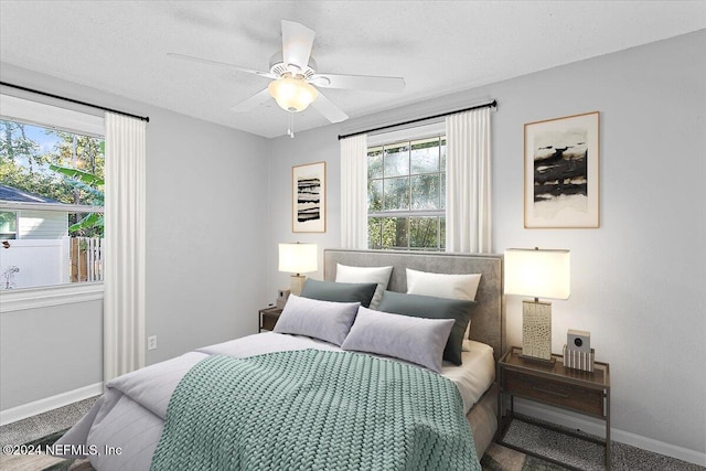 carpeted bedroom featuring ceiling fan