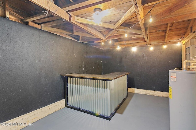 interior space with concrete floors and water heater